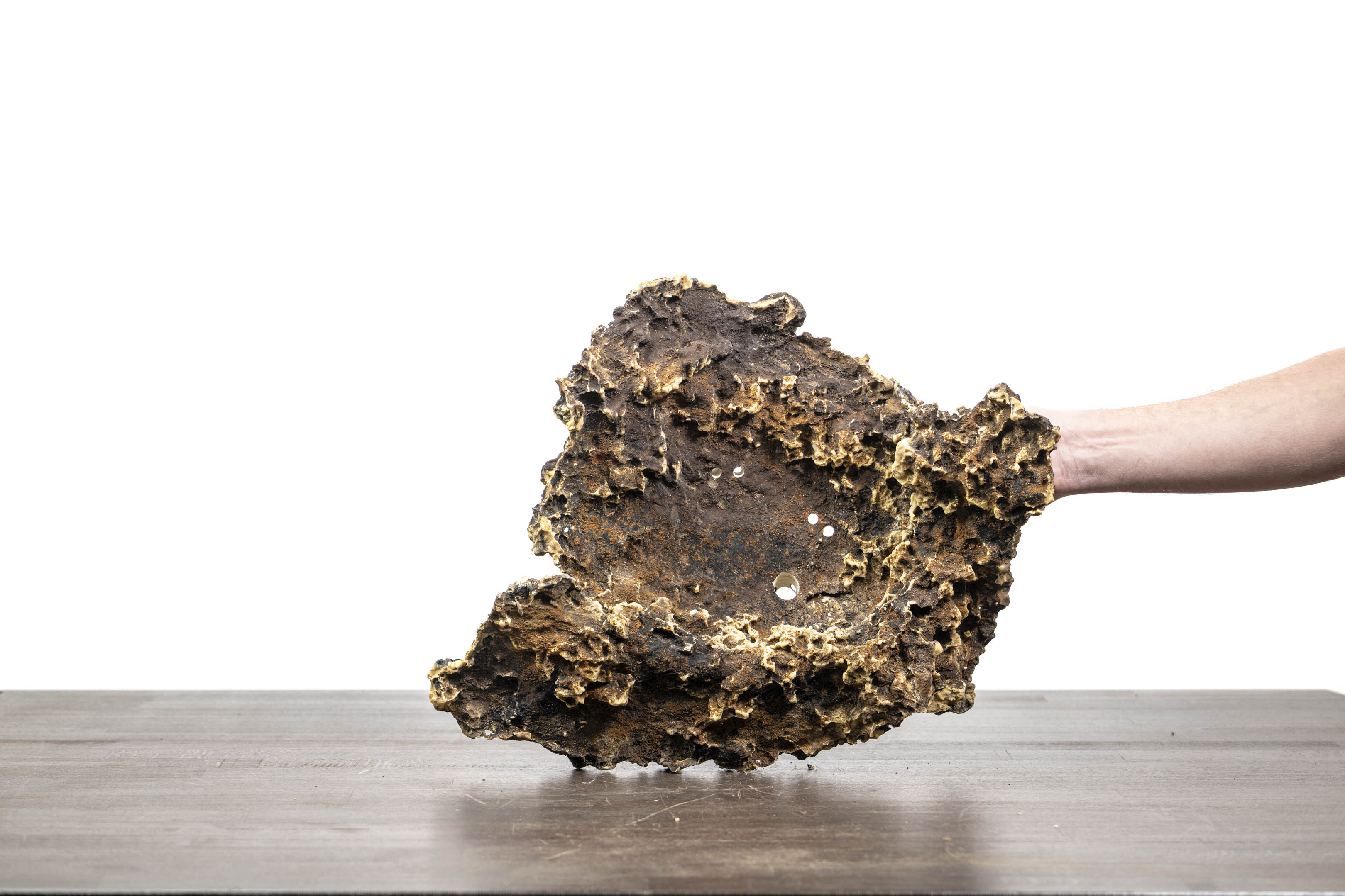 Slab No. 56 standing upright, showing the planting area and holes in the base